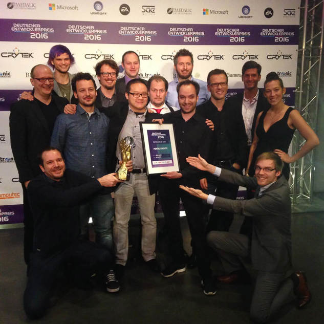  Multiple Keen employees holding up an award at a ceremony